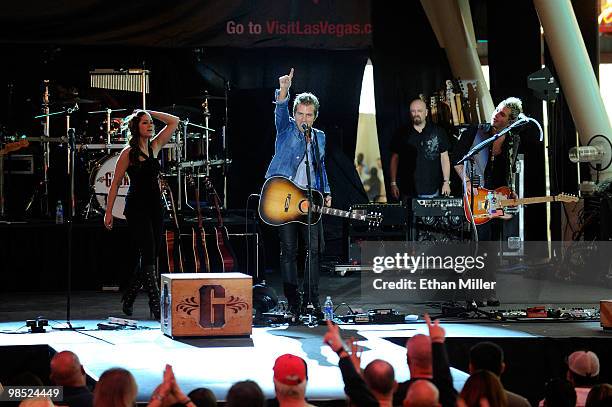 Musicians Rachel Reinert, Tom Gossin and Mike Gossin of the band Gloriana perform onstage at the 45th Annual Academy of Country Music Awards concerts...