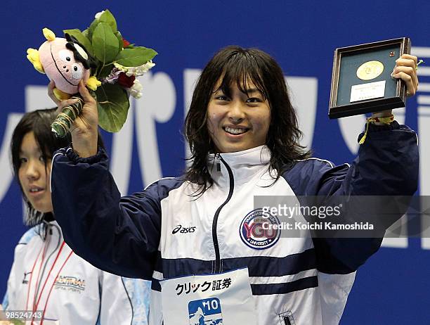 Satomi Suzuki celebrates winning the Women's 100m Breaststroke Final during the day six of the Japan Swim 2010 at Tokyo Tatsumi International...