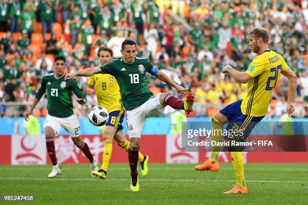 Andres Guardado of Mexico is challenged by Ola Toivonen of Sweden during the 2018 FIFA World Cup Russia group F match between Mexico and Sweden at...