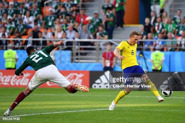 Ludwig Augustinsson of Sweden scores his team's first goal during the 2018 FIFA World Cup Russia group F match between Mexico and Sweden at...