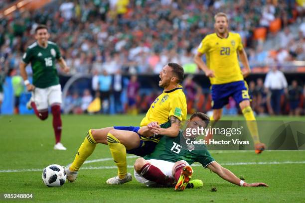 Hector Moreno of Mexico fouls Marcus Berg of Sweden inside the box to concede a penalty during the 2018 FIFA World Cup Russia group F match between...