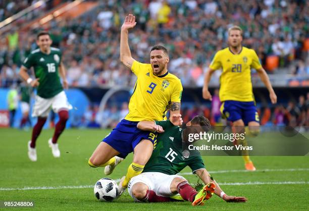 Hector Moreno of Mexico fouls Marcus Berg of Sweden inside the box to concede a penalty during the 2018 FIFA World Cup Russia group F match between...