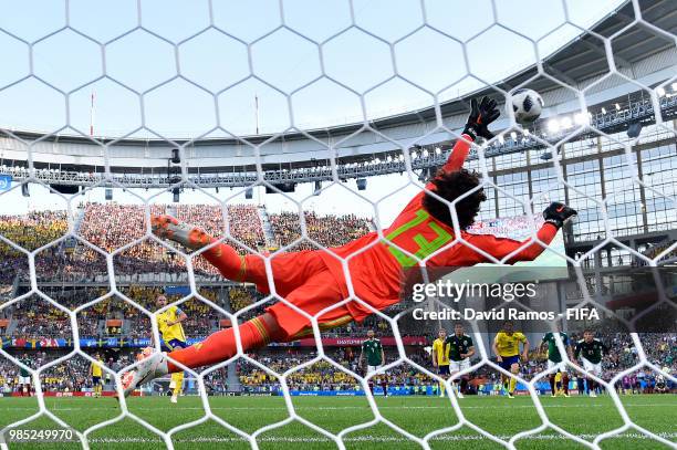 Andreas Granqvist of Sweden scores past Guillermo Ochoa of Mexico his team's second goal from the penalty spot during the 2018 FIFA World Cup Russia...