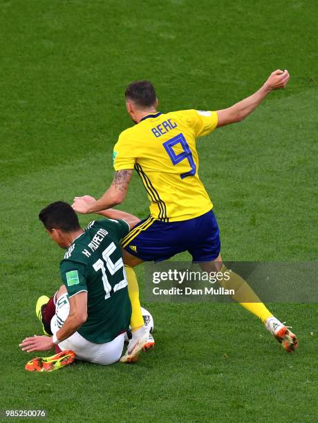 Hector Moreno of Mexico fouls Marcus Berg of Sweden inside the box to concede a penalty during the 2018 FIFA World Cup Russia group F match between...