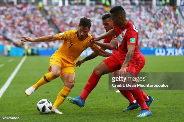 Matthew Leckie of Australia battles for the ball with Miguel Trauco and Anderson Santamaria during the 2018 FIFA World Cup Russia group C match...