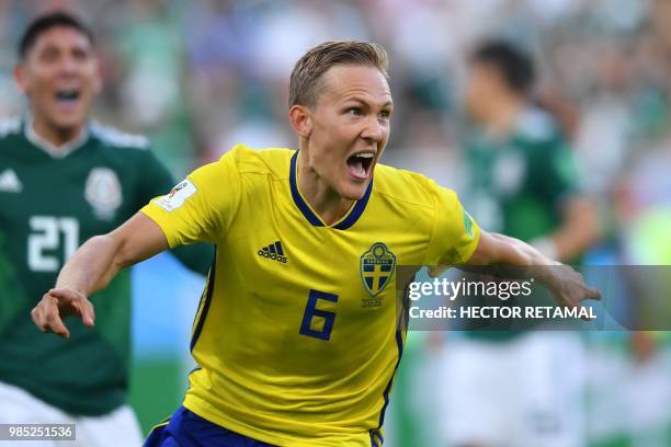 Sweden's defender Ludwig Augustinsson celebrates after scoring the opening goal during the Russia 2018 World Cup Group F football match between...