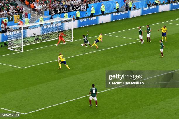 Edson Alvarez of Mexico scores an own goal to put Sweden 3-0 during the 2018 FIFA World Cup Russia group F match between Mexico and Sweden at...