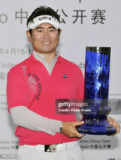 Yang of Korea poses with the trophy after winning the Volvo China Open on April 18, 2010 in Suzhou, China.