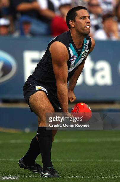 Troy Chaplin of the Power handballs during the round four AFL match between the Geelong Cats and the Port Adelaide Power at Skilled Stadium on April...