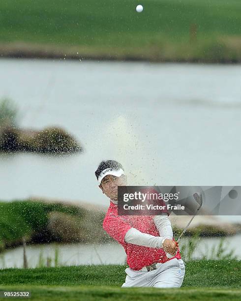 Yang of Korea plays a bunker shot on the 1st hole during the Round Four of the Volvo China Open on April 18, 2010 in Suzhou, China.