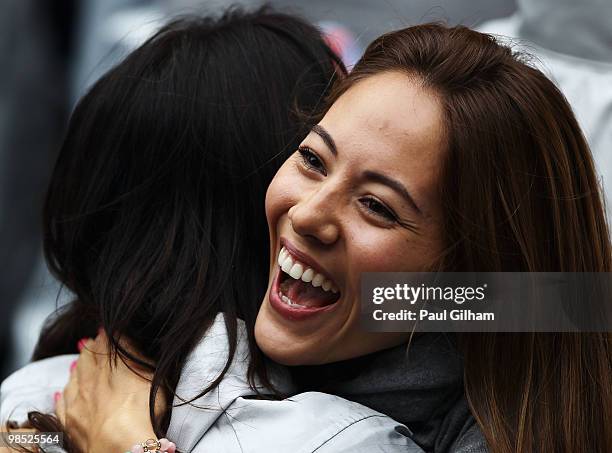 Jenson Buttons girlfriend Jessica Michibata celebrates following his victory during the Chinese Formula One Grand Prix at the Shanghai International...