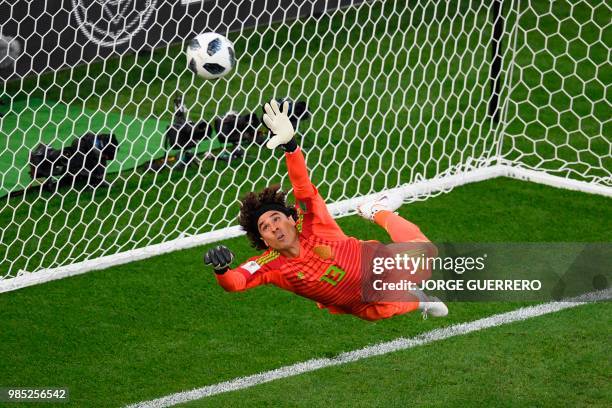 Mexico's goalkeeper Guillermo Ochoa fails to save a penalty during the Russia 2018 World Cup Group F football match between Mexico and Sweden at the...