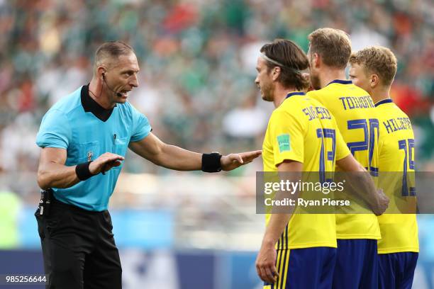 Referee Nestor Pitana speaks to Gustav Svensson, Ola Toivonen and Oscar Hiljemark of Sweden during the 2018 FIFA World Cup Russia group F match...