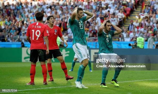 Mario Gomez of Germany and Mats Hummels of Germany react after a missed chance during the 2018 FIFA World Cup Russia group F match between Korea...