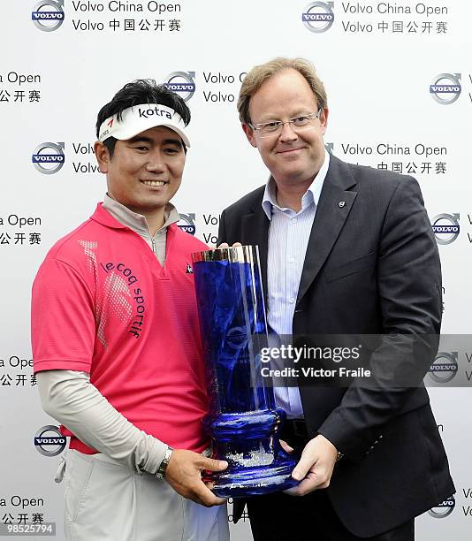 Yang of Korea poses with Per Ericsson President & CEO of Volvo Event Managment after winning the Volvo China Open on April 18, 2010 in Suzhou, China.