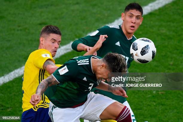 Mexico's defender Carlos Salcedo, Mexico's defender Edson Alvarez and Sweden's defender Mikael Lustig vie for the ball during the Russia 2018 World...