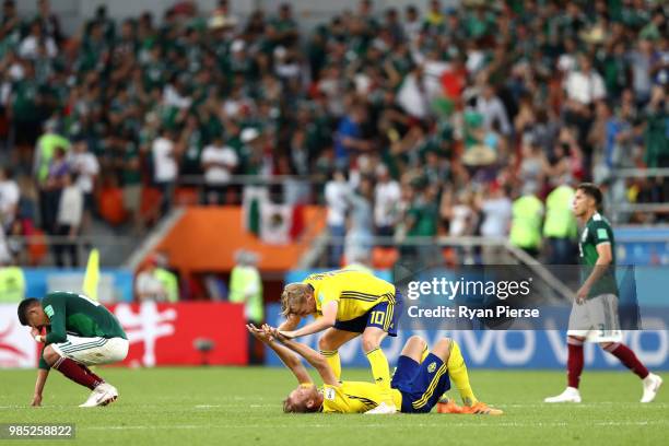 Emil Forsberg and Ola Toivonen of Sweden celebrate at the final whistle following the 2018 FIFA World Cup Russia group F match between Mexico and...