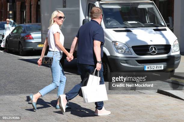 James Corden and Julia Carey seen shopping in Mayfair on June 27, 2018 in London, England.