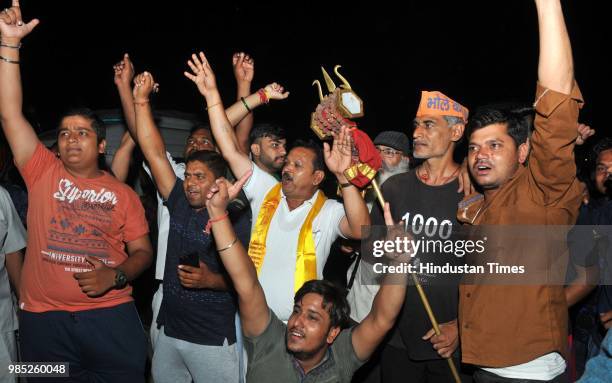 Devotees chant religious slogans as the first batch of Hindu pilgrims leave for Amarnath Yatra, an annual pilgrimage to the Amarnath shrine, on June...