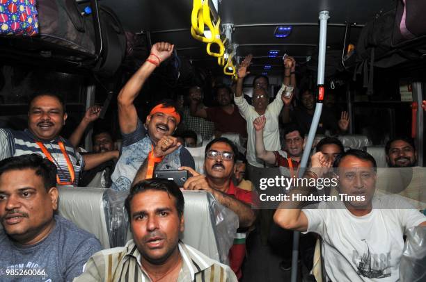 Devotees chant religious slogans as the first batch of Hindu pilgrims leave for Amarnath Yatra, an annual pilgrimage to the Amarnath shrine, on June...