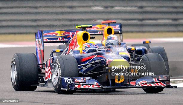 Red Bull-Renault driver Mark Webber of Australia leads teammate Sebastian Vettel of Germany during Formula One's Chinese Grand Prix in Shanghai on...