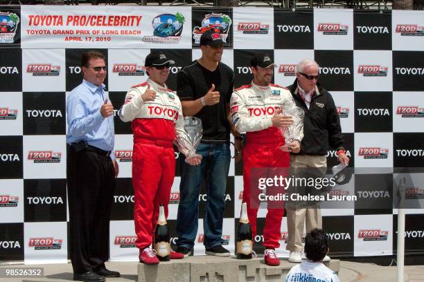 Professional racecar driver Jimmy Vasser , NFL player Tony Gonzalez of the Atlanta Falcons and actor Brian Austin Green pose with Toyota executives...