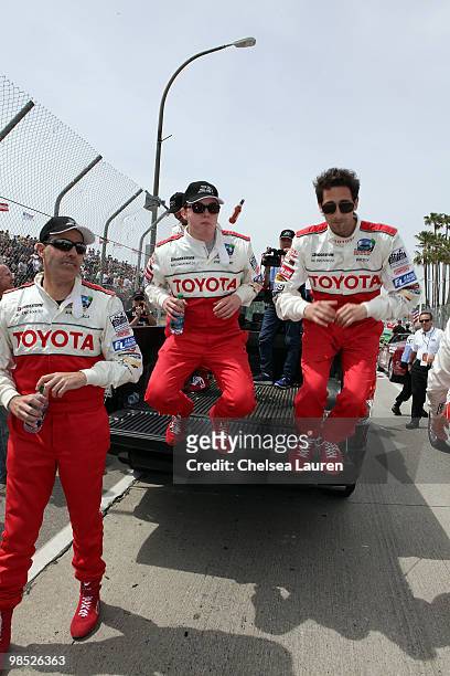 Actor / comedian Adam Carolla, singer Jesse McCartney and actor Adrien Brody enter the track at the Toyota Grand Prix Pro / Celebrity Race Day on...