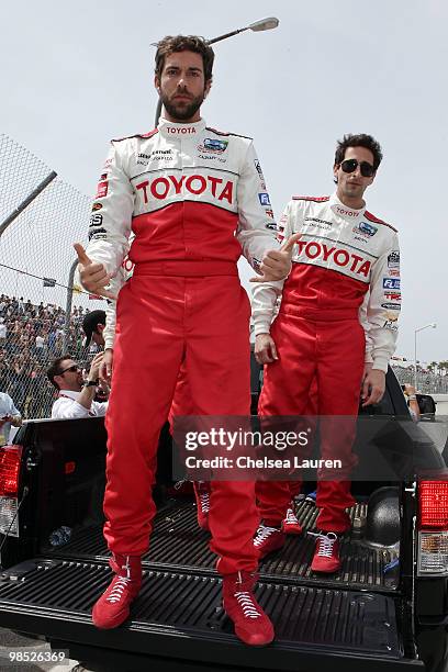 Actors Zachary Levi and Adrien Brody enter the track at the Toyota Grand Prix Pro / Celebrity Race Day on April 17, 2010 in Long Beach, California.