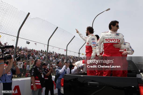 Actors Zachary Levi and Adrien Brody enter the track at the Toyota Grand Prix Pro / Celebrity Race Day on April 17, 2010 in Long Beach, California.