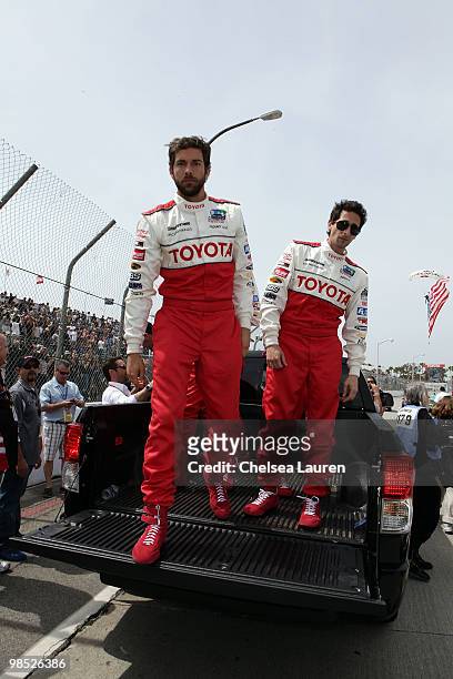 Actors Zachary Levi and Adrien Brody enter the track at the Toyota Grand Prix Pro / Celebrity Race Day on April 17, 2010 in Long Beach, California.