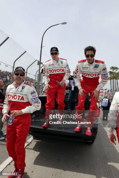 Actor / comedian Adam Carolla, singer Jesse McCartney and actor Adrien Brody enter the track at the Toyota Grand Prix Pro / Celebrity Race Day on...