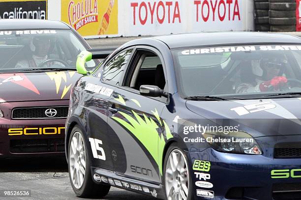 Actors Keanu Reeves and Christian Slater race at the Toyota Grand Prix Pro / Celebrity Race Day on April 17, 2010 in Long Beach, California.