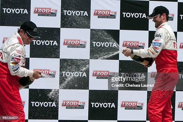 Professional racecar driver Jimmy Vasser and actor Brian Austin Green in the winner's circle at the Toyota Grand Prix Pro / Celebrity Race Day on...