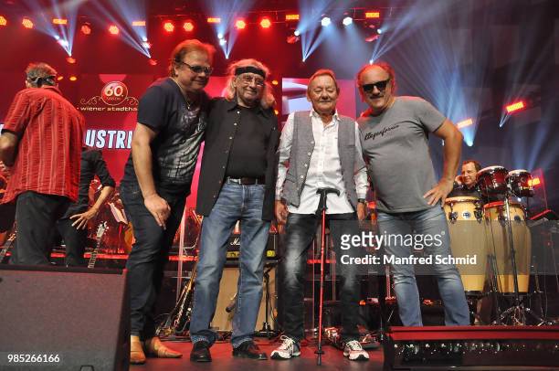 Ewald Sunny Pfleger, Schiffkowitz, Wolfgang Ambros and Herwig Ruedisser pose on stage during the 'Best of Austria meets Classic' Concert at Wiener...