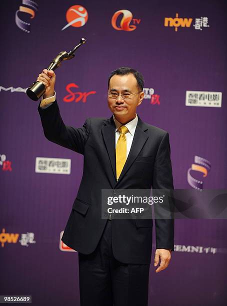 Best director winner Cheung King-wai holds his trophy at the Hong Kong Film Awards on April 18, 2010. The annual awards are the Hong Kong equivalent...