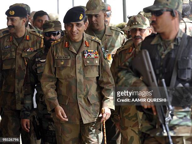Pakistani Army Chief General Ashfaq Kayani is escorted by army commandos as he arrives to watch the military exercise in Bahawalpur on April 18,...