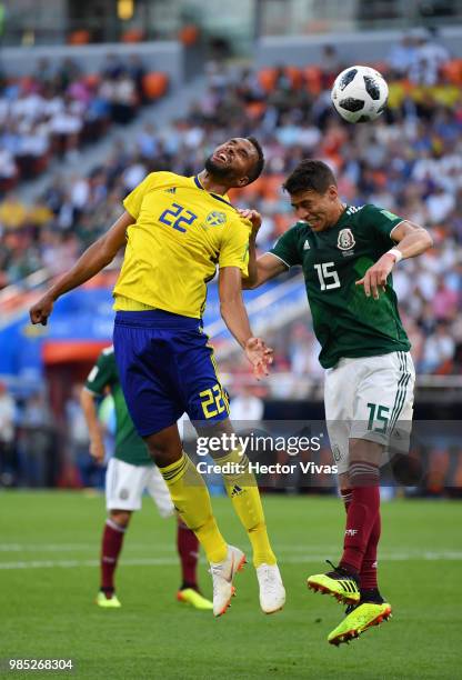 Isaac Kiese Thelin of Sweden vies with Hector Moreno of Mexico during the 2018 FIFA World Cup Russia group F match between Mexico and Sweden at...