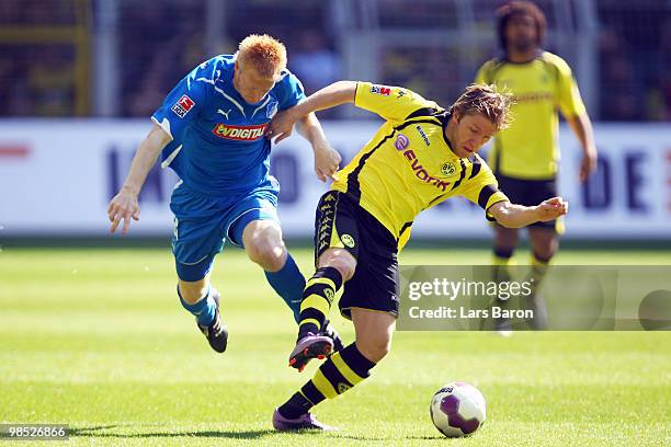 Andreas Ibertsberger of Hoffenheim challenges Jakub Blaszczykowski of Dortmund during the Bundesliga match between Borussia Dortmund and 1899...