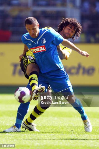 Patrick Owomoyela of Dortmund challenges Sejad Salihovic of Hoffenheim during the Bundesliga match between Borussia Dortmund and 1899 Hoffenheim at...