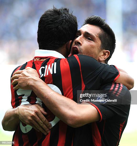 Marco Borriello of AC Milan celebrates with Alessandro Mancini after scoring Milan's opening goal during the Serie A match between UC Sampdoria and...