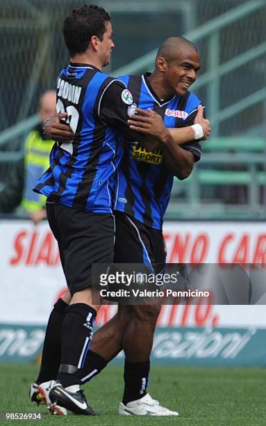 Adriano Ferreira Pinto of Atalanta BC celebrates his 1:0 goal with team-mate Simone Padoin during the Serie A match between Atalanta BC and ACF...