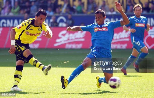 Lucas Barrios of Dortmund shoots on goal next to Luiz Gustavo of Hoffenheim during the Bundesliga match between Borussia Dortmund and 1899 Hoffenheim...
