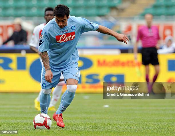 Ezequiel Lavezzi of Napoli shoots to score the opening goal of the Serie A match between AS Bari and SSC Napoli at Stadio San Nicola on April 18,...
