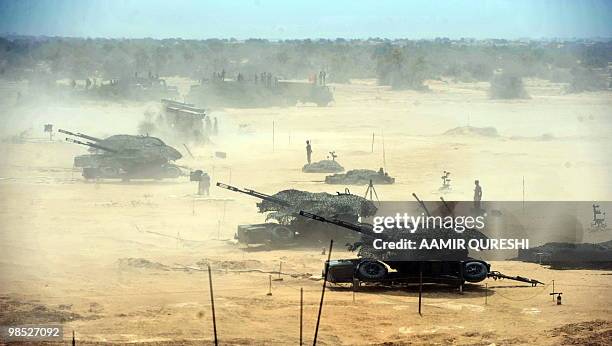 Pakistan soldiers use weaponry to hit their targets as they take part in a military exercise in Bahawalpur on April 18, 2010. The "Azm-e-Nau-3"...