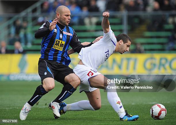 Simone Tiribocchi of Atalanta BC challenges for the ball with Alessandro Gamberini of ACF Fiorentina during the Serie A match between Atalanta BC and...