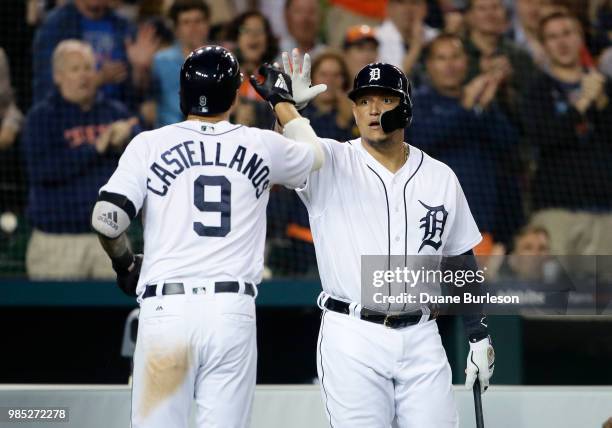 Nicholas Castellanos of the Detroit Tigers celebrates with Miguel Cabrera of the Detroit Tigers after hitting a home run against the Toronto Blue...