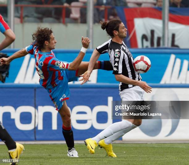 Ciro Capuano of Catania Calcio battles for the ball with Marcelo Larrondo of AC Siena during the Serie A match between Catania Calcio and AC Siena at...