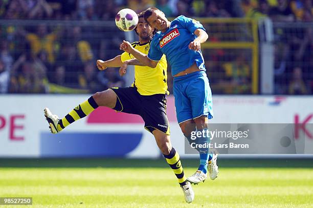 Patrick Owomoyela of Dortmund and Sejad Salihovic of Hoffenheim jump for a header during the Bundesliga match between Borussia Dortmund and 1899...