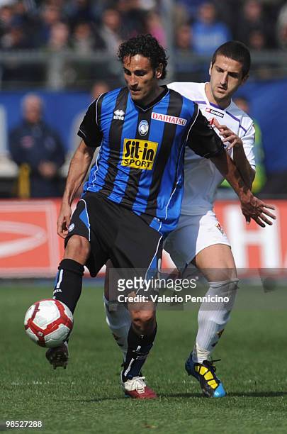 Nicola Amoruso of Atalanta BC battles for the ball with Alessandro Gamberiniof ACF Fiorentina during the Serie A match between Atalanta BC and ACF...