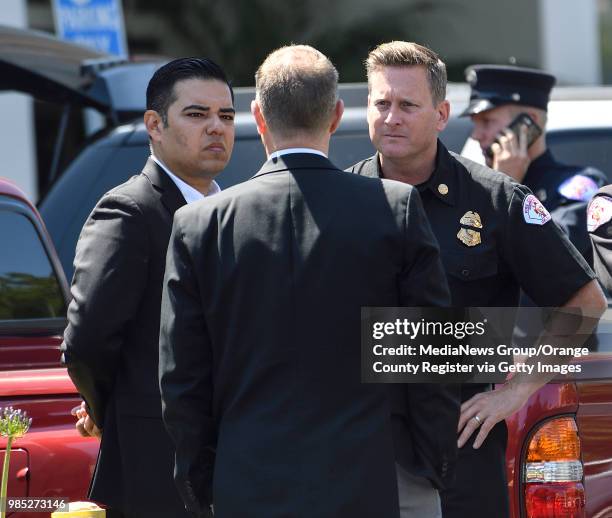 Long Beach Mayor Rober Garcia, left, and Fire Chief Mike Duree outside St. Mary Medical Center after Long Beach Fire Department Capt. Dave Rosa was...